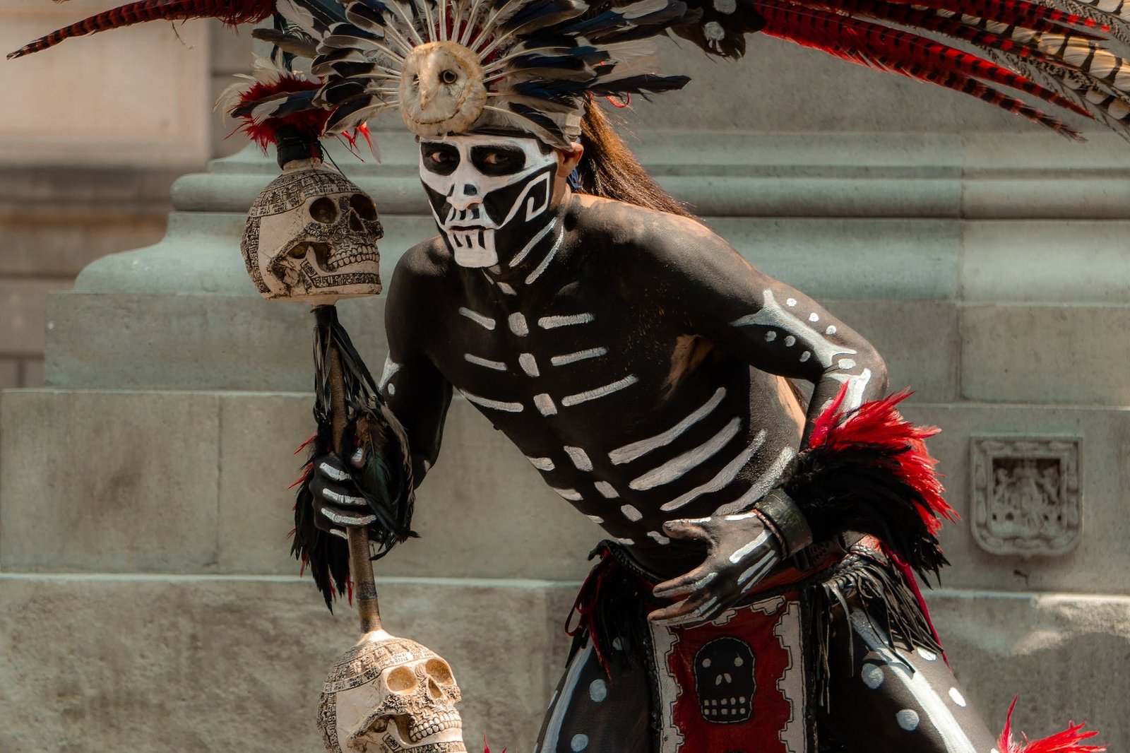 person in aztec warrior costume